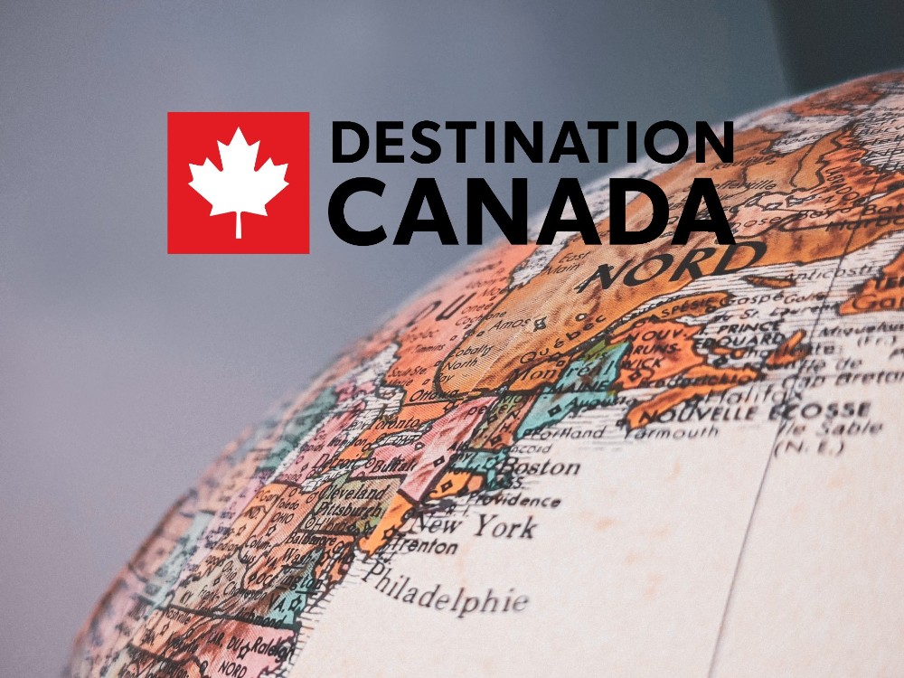 destination canada logo y globo terráqueo